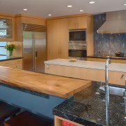 To counter the strong linear look of the cabinetry, countertop, flooring, hardwood, interior design, kitchen, real estate, room, wood