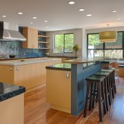 This spacious kitchen is part of a large, cabinetry, countertop, floor, flooring, hardwood, interior design, kitchen, real estate, room, wood flooring, gray