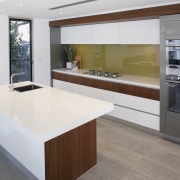 This award-winning kitchen features timber veneer framing around cabinetry, countertop, cuisine classique, floor, interior design, kitchen, real estate, white, gray