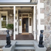 A central hallway provides a vista right through facade, house, window, white, gray