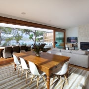 The large sliders is this remodelled house are house, interior design, living room, property, real estate, gray