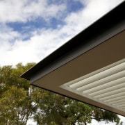 Cantilevered awning on contemporary home - Cantilevered awning architecture, cloud, daylighting, daytime, facade, home, house, residential area, roof, siding, sky, sunlight, tree, brown, gray