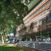 Communal area near entry to Tyree Energy Technologies architecture, building, city, landmark, metropolitan area, mixed use, plaza, structure, tree, urban area, brown