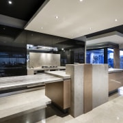 ELiving areas and kitchen are seamlessly integrated in countertop, interior design, kitchen, gray, black