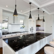 The island bench top features a single slab countertop, interior design, kitchen, room, gray