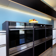 Modern kitchen with bank of Fisher &amp; Paykel cabinetry, countertop, interior design, kitchen, shelving, black, gray