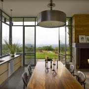 With the doors open, the kitchen in this architecture, dining room, home, house, interior design, real estate, window, brown