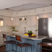Off-white perimeter cabinetry and subway tiles impart a cabinetry, countertop, cuisine classique, interior design, kitchen, room, gray