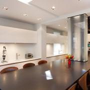 Windows on the rear wall of this kitchen ceiling, countertop, interior design, kitchen, real estate, table, gray
