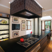 A custom tiled range hood is a key countertop, interior design, kitchen, room, black, gray