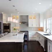 While the perimeter cabinetry in off-white lacquer has cabinetry, ceiling, countertop, cuisine classique, interior design, kitchen, room, gray