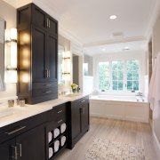 A long dark mahogany vanity provides plenty of bathroom, cabinetry, countertop, estate, home, interior design, kitchen, property, real estate, room, sink, gray