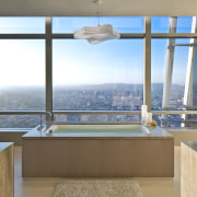 This Kohler tub is positioned to maximize a apartment, architecture, bathroom, daylighting, estate, home, interior design, property, real estate, room, window, brown