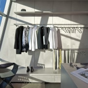 The dressing room in the master suite resembles product design, gray, white