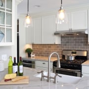 Gray tiles on the backsplash complement the white countertop, cuisine classique, home, interior design, kitchen, room, white