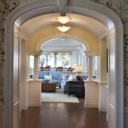 A hallway now provides an easy transition from arch, architecture, ceiling, estate, floor, flooring, home, interior design, wall, gray, brown
