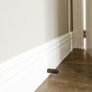 Chant customisable residential doorstop in Weathered Brass from floor, flooring, furniture, hardwood, interior design, laminate flooring, light, product design, property, wall, wood, wood flooring, wood stain, white