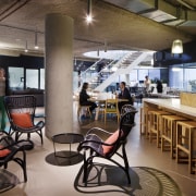 Breakout spaces in the Aurecon office are set café, interior design, restaurant, brown, black
