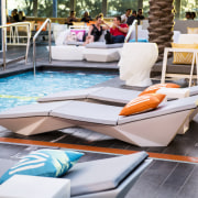 Angular loungers and tables in the shape of chair, floor, flooring, furniture, leisure, outdoor furniture, sunlounger, table, white