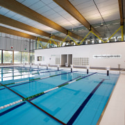 A moveable floor covers a large section of daylighting, indoor games and sports, leisure, leisure centre, sport venue, structure, swimming pool, water, gray, teal
