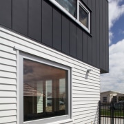 Doors and windows in this Ideal House were architecture, building, commercial building, elevation, facade, home, house, real estate, residential area, siding, window, black, gray, white