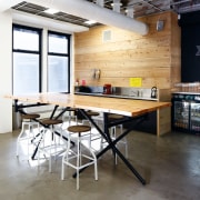 The wood and stainless steel kitchen and adjacent countertop, flooring, furniture, interior design, kitchen, loft, table, white, black