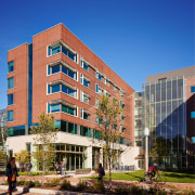 San Francisco Residence Hall at left continues the apartment, architecture, building, campus, city, commercial building, condominium, corporate headquarters, daytime, downtown, elevation, facade, headquarters, home, house, metropolitan area, mixed use, neighbourhood, property, real estate, residential area, sky, tower block, urban area, window, blue