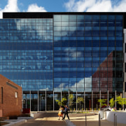 The precast concrete facade of the Harry Perkins architecture, building, city, commercial building, condominium, corporate headquarters, daytime, facade, headquarters, metropolis, metropolitan area, mixed use, neighbourhood, real estate, residential area, sky, urban area, window