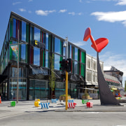 Mixed-use commercial developments are once again enlivening the architecture, building, city, daytime, downtown, house, landmark, metropolitan area, mixed use, neighbourhood, sky, urban area, teal, gray