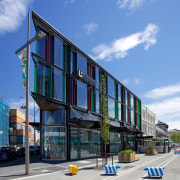 Mixed-use commercial developments are once again enlivening the apartment, architecture, building, commercial building, condominium, corporate headquarters, facade, headquarters, house, metropolitan area, mixed use, neighbourhood, real estate, residential area, sky, teal