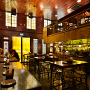 Materials recycled from demolished Christchurch houses feature in bar, café, interior design, lobby, restaurant, brown