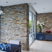 Walls clad in Virginia Ledgestone stone veneers from brick, floor, home, interior design, living room, real estate, wall, gray