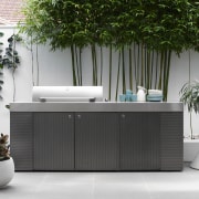 This large custom barbecue designed by Secret Gardens flowerpot, furniture, interior design, product design, table, gray, white