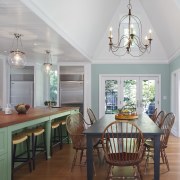 A high ceiling demarcates the breakfast area from ceiling, dining room, floor, hardwood, home, interior design, living room, real estate, room, table, wall, wood flooring, gray