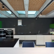 A black glass splashback and black quartz stone architecture, ceiling, daylighting, house, interior design, black