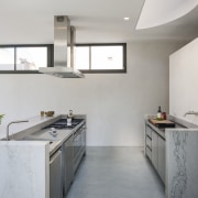 A curved skylight above this new kitchen echoes architecture, bathroom, countertop, floor, home, interior design, kitchen, real estate, room, sink, tap, gray