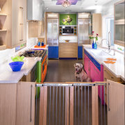 This colorful kitchen by Elina Katsioula-Beall features a cabinetry, countertop, floor, interior design, kitchen, room, white