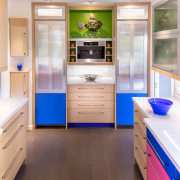 In this colorful kitchen, twin columns accommodating a cabinetry, countertop, home appliance, interior design, kitchen, room, white