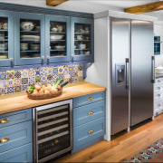 A new blue hutch in this remodeled kitchen cabinetry, countertop, cuisine classique, home appliance, interior design, kitchen, refrigerator, room, gray