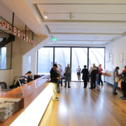 The clock towers structure is visible from the institution, interior design, lobby, gray