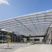 A semi-transparent roof element, which echoes the form architecture, building, convention center, corporate headquarters, daylighting, facade, headquarters, metropolitan area, mixed use, roof, structure, gray, teal