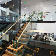 Natural materials feature extensively throughout the new Ricoh architecture, glass, handrail, interior design, stairs, black, white