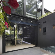 The glass door at the rear of this architecture, building, house, window, black, white, gray