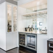 Glass display cabinets with interior lighting enliven the countertop, home appliance, interior design, kitchen, major appliance, refrigerator, white