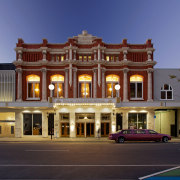 The Isaac Theatre Royal in Christchurch has undergone architecture, building, city, classical architecture, commercial building, downtown, elevation, estate, facade, home, hotel, house, landmark, mansion, metropolis, metropolitan area, mixed use, neighbourhood, plaza, real estate, residential area, sky, town, blue