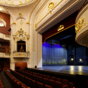 The restored Isaac Theatre Royal in Christchurch sits auditorium, ceiling, function hall, interior design, lobby, opera house, performing arts center, theatre, black, orange