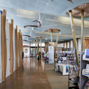 In the new Waiheke library, tall timber columns ceiling, institution, interior design, library, public library, gray, brown