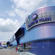 The Roermond Retail Park highlightd EuraMica Amethyst Purple architecture, blue, building, daytime, landmark, metropolitan area, sky, sport venue, stadium, structure, white