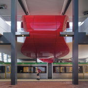 This curved red canopy in the new Butler architecture, daylighting, metropolitan area, structure, gray