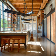 In this converted heritage building, entertainment facilities, including architecture, ceiling, interior design, lobby, loft, real estate, wood, brown